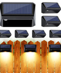 Solar Fence Lights 6 Pack With 8 Modes Warm White Cool White RGB, mounted on fence, illuminating wooden wall at night