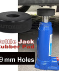 Heavy Duty Bottle Jack Pad Adapter Rubber With 29mm Hole And 1 1/8 Inch Recess On Bottom Jacking Point, Universal Fit For 5 To 6 Ton Bottle Jacks, Prevent Slippage And Car Damage During Lifts, shown in use under vehicle.