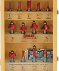 13 Piece Super Bit Router Bit Set With 1/2 Inch Shank In Wall Mount Shadow Box Case displaying organized woodworking bits