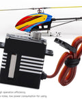 Premium Full Metal Waterproof Steering Gear Servo DS290MG beside an RC helicopter, showcasing its aluminum body and control features.