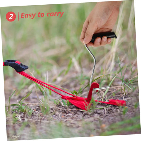 Using Tent Stake Puller Tool For Camping Peg Remover And Extractor, Lightweight Portable Design in outdoor setting, pulling stake from ground.