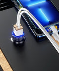 Grab And Go Dual Usb Car Charger With Fast Charge Ports Solid Cigarette Lighter Adapter connected to a smartphone on a sleek surface.