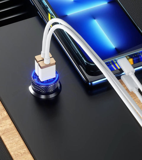 Grab And Go Dual Usb Car Charger With Fast Charge Ports Solid Cigarette Lighter Adapter connected to a smartphone on a sleek surface.