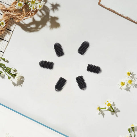 Heavy Hitter Stainless Steel Ball Plunger Set Screws M4X6 Hex Socket Cap 50 Pack on a white background with flowers.