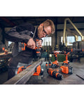 Man using Ultra Lightweight Brushless Cordless Drill Featuring Four Speeds And Mechanical Torque Control for precise drilling on metal.