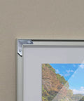 Rock Solid L Shaped Corner Brace Brackets 30 Pack 35x13mm used to secure a picture frame corner with visible screws.