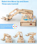 Hands On Robotic Arm Kit For Kids And Teens Aged 8 To 16, Totally Fun Kid Friendly STEM Toy For Learning Coding, Motors, Microcontroller, Circuits, And DIY Engineering Projects. Wooden robotic arm kit with base, motors, and remote control