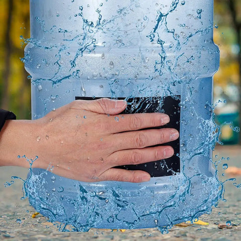 Hand applying 150Cm Heavy Duty Waterproof Rubber Tape For Quick Leak Stop And Repair On Any Surface Self Adhesive Patch Durable And Flexible For DIY Fixes On Plumbing Roofs Hoses And More White to stop water leak on container
