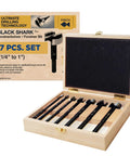 Tough As Nails Forstner Drill Bit Set Forged Steel Center Points For Hella Smooth Woodworking And Precision Hole Drilling One Quarter To One Inch Seven Piece Pro Kit in a wooden box with drill bits.