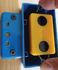 Hands using Drywall Electrical Box Locator Tool With Rare Earth Magnets Blind Mark Kit With 3 Magnetic Targets for outlet box placement.