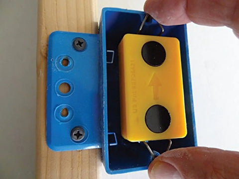Hands using Drywall Electrical Box Locator Tool With Rare Earth Magnets Blind Mark Kit With 3 Magnetic Targets for outlet box placement.