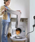 DIY Dryer Outlet Adapter Ideal For Moving Into A New House Converts 14-30P Four Prong Dryer Plug To 10-30R Three Prong Outlet No Electrician Needed Quick Plug Converter For Easy At Home Laundry Setup connected to wall outlet with person doing laundry