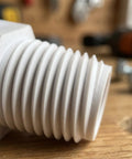 16 Pack Half Inch PVC Male Thread Nipples NPT Heavy Duty Male to Male Coupling Connectors for Home DIY Plumbing and Industrial Pipe Fittings, Premium White PVC Nipple Set close-up of white 1/2 inch PVC male-thread nipple