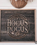 Hocus Pocus sign with wood background featuring the Sanderson Sisters and Enchanted Brooms design, rustic home decor.