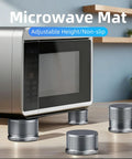 Heavy Duty Adjustable Metal Microwave Riser And Air Fryer Stand Elevators With Non Slip Pads Four Pack multi-purpose leveling shims under a microwave.