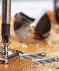 5 pcs Heavy Duty Stainless Steel M8x40 Flat Head Pins For Scaffolding Fixing displayed on a wooden surface with a drill.