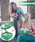 Two women exchanging gifts with an inset showing Outdoor Wind Chimes And Hummingbird Feeder Duo For Your Garden Vibes package.