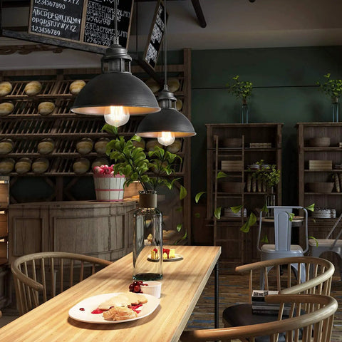 Industrial Silver Brushed Pendant Light With Top Cutouts illuminating a bakery-style kitchen island dining setup