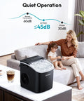 EUHOMY black countertop ice maker with transparent lid and ice cubes visible on a white table
