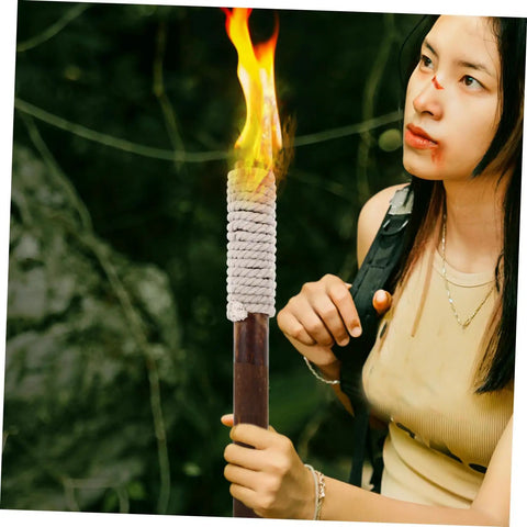Person holding an Outdoor Wood Torch Lantern For Garden And Patio Decor, Flickering Flame Light For Walkways And Yards.