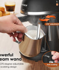 No Hassle Portable Coffee Machine With Quick Turn 800 Watt Espresso And Cappuccino Maker Featuring Built In Milk Frother For Straight Up Lattes And Smooth Daily Grinds Black with adjustable steam wand in use.