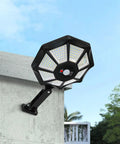 Solar Flood Light 168LED Motion Sensor IP66(168LED) mounted on a wall with bright LED design against a clear blue sky.