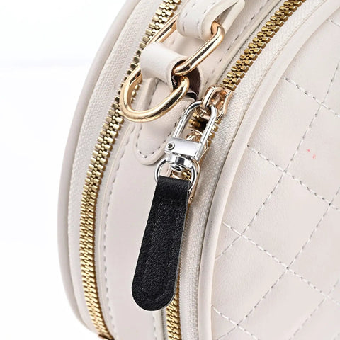 Close-up of a black zipper pull on a handbag, 10 Piece Leather Zipper Pull Replacement Kit For Luggage Backpacks Jackets Purses Handbags And Suitcases Durable PU Leather And Zinc Alloy 2.68 X 0.51 X 0.12 Inches Easy No Tool Install.