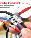 Hand holding wires with Beefy 520 Piece Non Insulated Butt Connectors Kit For 26 To 8 Gauge Wires Tinned Copper Marine Grade