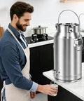 Man using Beast Mode 20L Stainless Steel Beverage Dispenser With Faucet Thickened Body And Durable Handle in kitchen