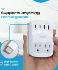 Person holding World Travel Adapter Kit With 2 US Outlets 2 USB A Quick Charge 3.0 2 USB C 20W Power Delivery Surge Protection SWADAPT