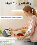 Woman using Indoor 2K Security Cam With 360 Degree Pan Tilt on smart display, compatible with Alexa and Google Home.