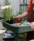 Person holding Do-It-All Garden Tidy Tray Do It All Potting Tray For Seed Starting And Soil Mixing - Durable BPA-Free Plastic