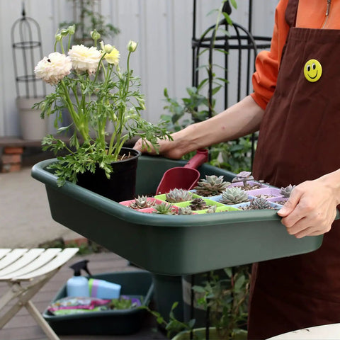 Person holding Do-It-All Garden Tidy Tray Do It All Potting Tray For Seed Starting And Soil Mixing - Durable BPA-Free Plastic