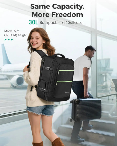 Woman wearing Underseat Carry On Travel Backpack With Removable Shoe Compartment For Mess Free Packing TSA Approved Waterproof Fits 17.3 Inch Laptop 18 By 14 By 8 Inches Black at airport