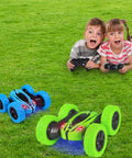 Kids playing with Two Pack RC Stunt Cars for Kids Fast 2.4GHz Remote Control Off Road Rock Crawler 4WD on grass
