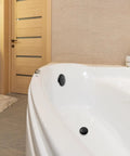 Matte Black Single Hole Bathtub Drain Overflow Plate With Solid Zinc Body And Matching Mounting Screws For A Sleek Look And Zero Drama Fast Install visible in a white bathtub.