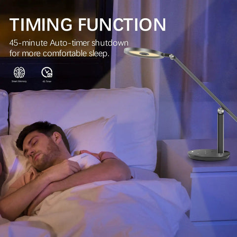 Dimmable LED Desk Lamp With Auto Off Timer And Memory Function illuminating a bedside table next to a sleeping man in a dim room.