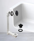 Pull And Drain Bath Waste With One Hole Overflow Matte Black One And A Half Inch Schedule Forty PVC Bath Drain And Overflow Assembly Easy Lift To Open Push To Close Single Screw Faceplate Brass Screw Included displayed in a bathtub setup