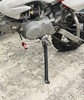 Dirt Bike Kick Stand For Dirt Pit Bikes 70cc To 200cc Replacement Part With 12 Inch Height Mini Bike Kickstand Durable Alloy Construction Easy Install, installed on bike.