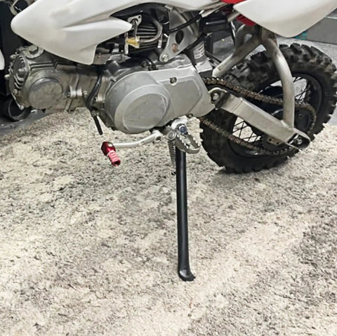 Dirt Bike Kick Stand For Dirt Pit Bikes 70cc To 200cc Replacement Part With 12 Inch Height Mini Bike Kickstand Durable Alloy Construction Easy Install, installed on bike.