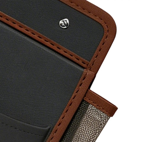 Close-up of Heavy Duty RV Wall Organizer with adhesive pockets, showing brown trim and black panel. Storage solution for campers.