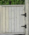 Heavy Duty T Shaped Iron Gate Hinges Matte Black on rustic wooden gate for outdoor use