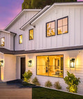 Built Like A Tank Dusk To Dawn Outdoor Wall Light 13 Inch Waterproof Sconce on white house porch illuminating entrance at night.
