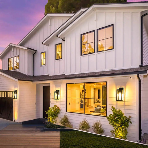 Built Like A Tank Dusk To Dawn Outdoor Wall Light 13 Inch Waterproof Sconce on white house porch illuminating entrance at night.