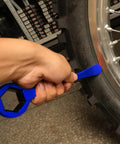 Universal Motorcycle Tire Change Kit With 10mm To 32mm Hex Wrench Levers changing dirt bike tire in garage