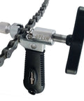 ATLIN bike chain tool (chain breaker) with black handle and silver body, chain engaged.