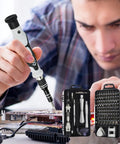 Person using 115-In-1 Precision Screwdriver Set for Electronics and DIY Repairs with Phillips, Flathead, Torx, Hex Bits on circuit board