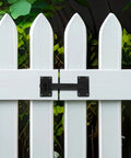 Built Tough Black Iron Fence Gate Latch With 12 Inch Long Bar Door Lock mounted on a white picket fence for secure closure.