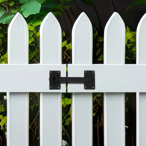Built Tough Black Iron Fence Gate Latch With 12 Inch Long Bar Door Lock mounted on a white picket fence for secure closure.