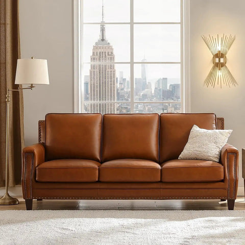Room with brown leather sofa, floor lamp, and Dope Gold Sunburst Wall Sconce Two Light Fixture For Bathroom And Living Spaces on wall.